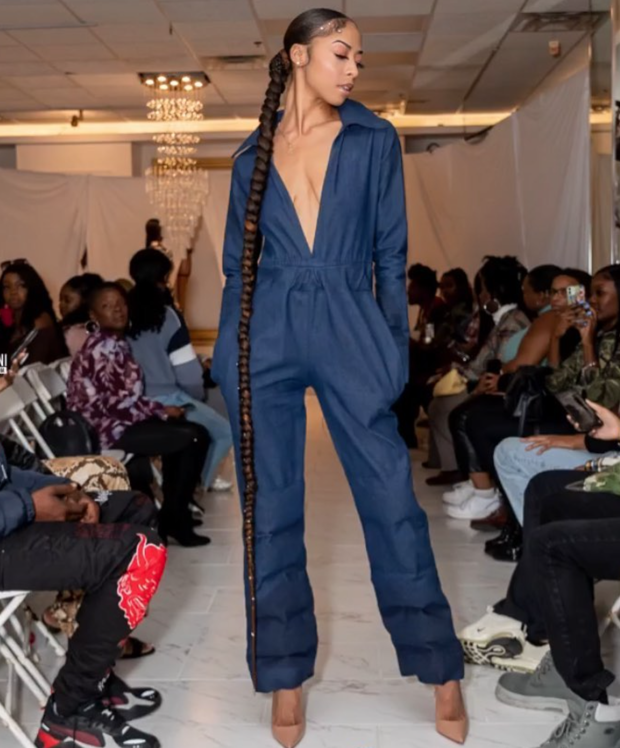 Long single braid styled for a runway show by Aisha